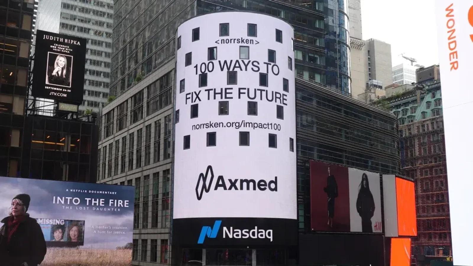 The Nasdaq Tower in Times Square showing the Axmed logo beneath Norrsken's 100 ways to fix the future